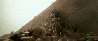 wwz-pile-of-people-climbing-wall-www-nerdatron-com-wwz-movie.gif